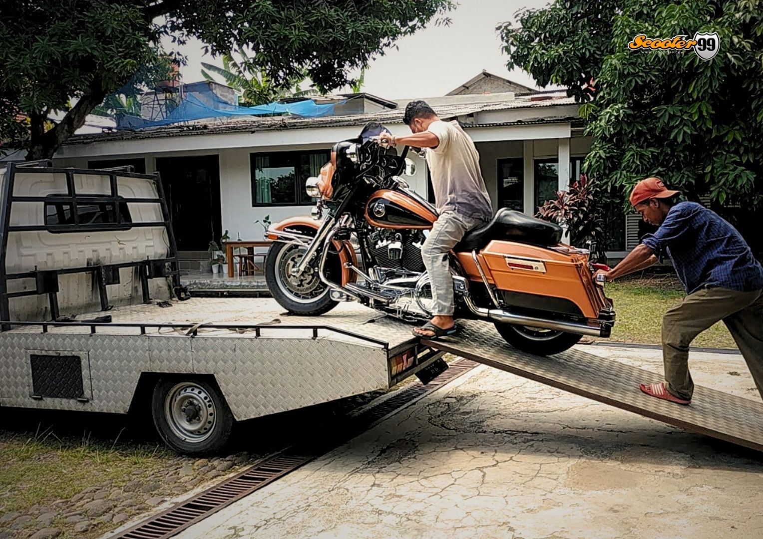 Towing truck in action, securing a vehicle on the roadside